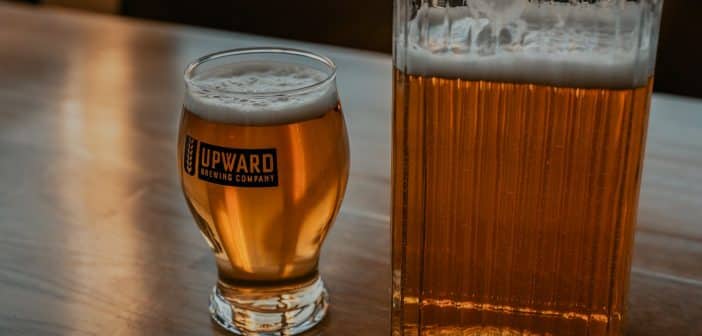 clear drinking glass with beer